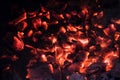 Wooden embers glowing pieces in stove Royalty Free Stock Photo