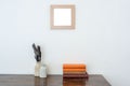 Wooden empty frame, old table, inkwells, and antique books