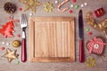 Wooden empty plate with rustic Christmas decorations. Menu background Royalty Free Stock Photo