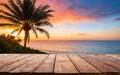 wooden empty table at sunset with palm trees and beach view Royalty Free Stock Photo