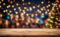 wooden empty table top with defocused bokeh Christmas fair lights background. Royalty Free Stock Photo