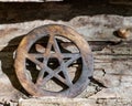 Wooden encircled pentagram symbol on fibrous tree bark. Five elements: Earth, Water, Air, Fire, Spirit.