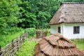 Wooden ethnic house with thatched roof. Halych Ethnography museum, Ukraine