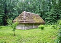 Wooden ethnic house with thatched roof. Halych Ethnography museum, Ukraine