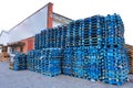 Pile of wooden euro pallets painted in blue