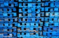 Pile of wooden euro pallets painted in blue
