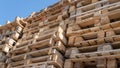 Wooden euro pallets for transfering goods to customers. Used wooden pallets in stack in the warehouse. Wooden pallet