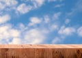 Wooden exhibition podium. 3D Background. Blue sky and clouds. 3D rendering