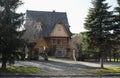 Wooden family house with shingled roofing