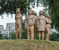 Wooden family sculpture in Ministergarten, Berlin, Germany.