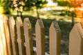 Wooden farm house fence with a trees in the background Royalty Free Stock Photo