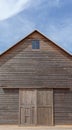 A wooden farm shed and blue sky Royalty Free Stock Photo