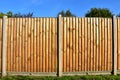 Wooden featheredge garden fence with concrete support posts Royalty Free Stock Photo