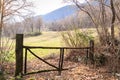 Wooden fence along countryside path. Rural landscape Royalty Free Stock Photo