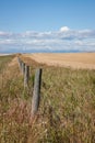 Vertical Crop of Wooden Fence Leading to Mountains and Prairie S Royalty Free Stock Photo