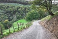 Wooden fence along a rural road in the mountains Royalty Free Stock Photo