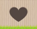 Wooden fence background with heart shape hole