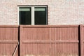 Wooden fence and brick and window Royalty Free Stock Photo