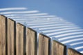 Wooden fence casting shadow