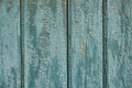 Wooden fence with cracked blue paint. Texture of the old wooden fence with faded blue paint. Royalty Free Stock Photo