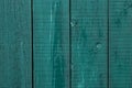 Wooden Fence Cracked Paint. Rough Wooden Boards Painted Green. Wood Texture Background, Oak Wood Wall Fence. Green Wooden Fence