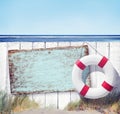 Wooden Fence and Empty Label on Beach