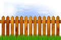 Wooden fence, grass and sky Royalty Free Stock Photo