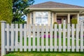 Wooden fence and house in background