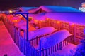 The wooden fence and house at night