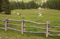 wooden fence long a mountain pasture in Val Gardena Royalty Free Stock Photo