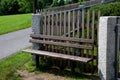 Wooden fence made of natural planks. the columns are made of roughly worked gray granite. fencing land in the mountains. meadow tr Royalty Free Stock Photo