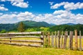 wooden fence on the meadow Royalty Free Stock Photo