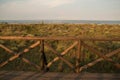 Wooden fence, meadow and sea landscape, Italy. Royalty Free Stock Photo