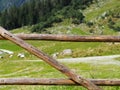 Wooden fence on a mountain pasture Royalty Free Stock Photo