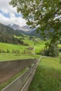 Wooden fence next to an Italian mountain pasture in St. Magdale Royalty Free Stock Photo