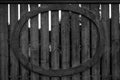 A wooden fence with an oval shape attatched