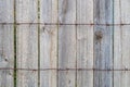 Wooden fence with rusty barbed wire in front. Grunge old wood wall background or texture. Natural pattern weathered wood Royalty Free Stock Photo