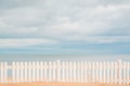 Wooden Fence in Sand on Beach. Royalty Free Stock Photo