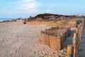 Wooden fence on sand dunes at Miramar beach on the Atlantic coast Royalty Free Stock Photo