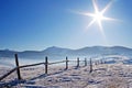 Wooden fence in snowcovered mountains Royalty Free Stock Photo
