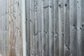 Wooden fence texture, wooden background. Background texture of old white painted wooden lining boards wall