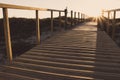 Wooden fence and walkway to beach faded. Empty path in sunlight. Walking concept. Camino de Santiago way. Royalty Free Stock Photo