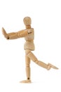 Wooden figure doing fitness exercises