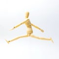 Wooden figure doll with jumping emotion for success business con Royalty Free Stock Photo