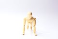 Wooden figure doll with push up emotion for sport exercise concept on white background Royalty Free Stock Photo