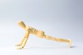 Wooden figure doll with push up for health on white for exercis Royalty Free Stock Photo