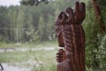 Wooden figure in the forest