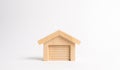 Wooden figure of a garage or warehouse. The concept of starting a new business, workshop in the garage. Inventions and innovations