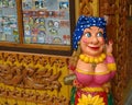 Wooden figure of a gypsy, wood carving decoration in the souvenir shop