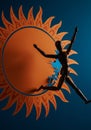 Wooden Figure Leaping Through Orange Pixel Sun Royalty Free Stock Photo